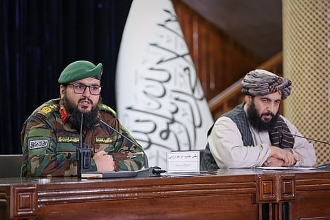 Enayatullah Khowarazmi , left, spokesman of the Defence Ministry, and Hamdullah Fitrat ,deputy spokesman for the Islamic Emirate of Afghanistan speak during a press conference in Kabul, Afghanistan, Tuesday, March 3, 2026.