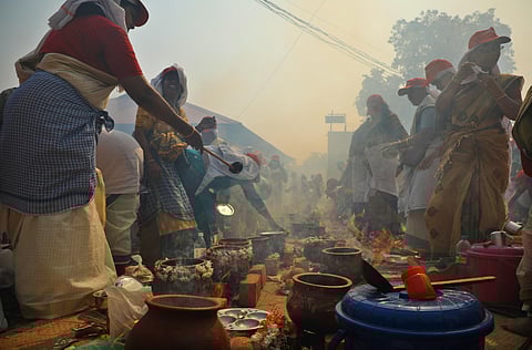 Thousands of women prepare sacred Pongala offerings amid rising smoke during Attukal Pongala at Attukal Bhagavathy Temple, in Thiruvananthapuram on Tuesday.