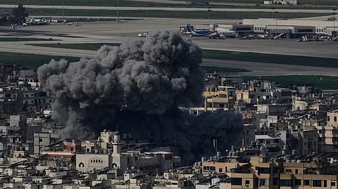 Smoke rises following an Israeli airstrike in Dahiyeh, Beirut's southern suburb, near Rafik Hariri International Airport, Lebanon, Wednesday, March 4, 2026.