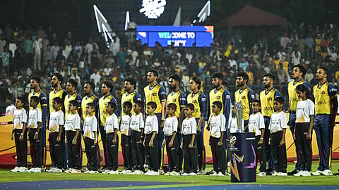 Sri Lanka team players stand for the national anthem next to the 2026 ICC Men's T20 Cricket World Cup trophy before the start of the tournament Super Eights match between Sri Lanka and Pakistan on February 28, 2026.