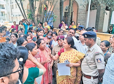 BSWML Chief Operating Officer Ramamani receives representations from link workers during a protest on Thursday