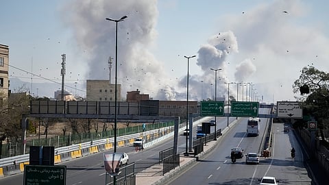 Plumes of smoke rise as strikes hit the city during the US–Israeli military campaign in Tehran, Iran, Thursday, March 5, 2026.