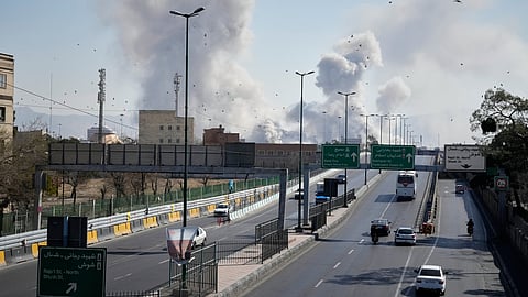 Plumes of smoke rise as strikes hit the city during the U.S.–Israeli military campaign in Tehran, Iran
