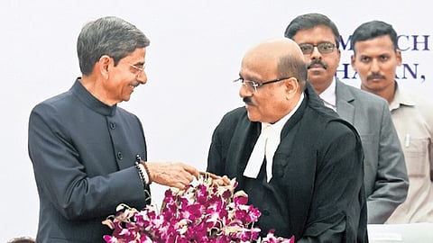 Governor RN Ravi and Justice Sushrut Arvind Dharmadhikari at Lok Bhavan on Friday