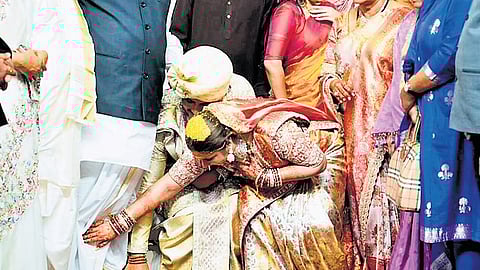 Newly weds Mallu Surya Vikramaditya and Sakshi take the blessings of AICC president Mallikarjun Kharge at GMR Arena in Hyderabad on Thursday.