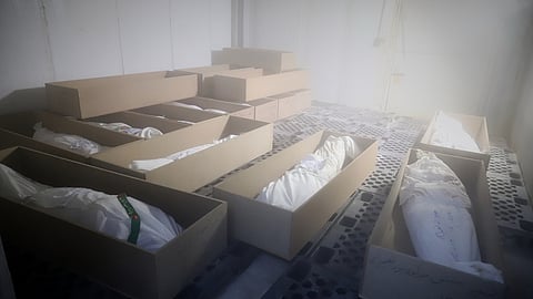 Coffins holding the bodies of mostly children sit in a room as they are prepared for the funeral of those killed in a US strike on Feb. 28 at a girls' elementary school in Minab, Iran, Tuesday, March 3, 2026.