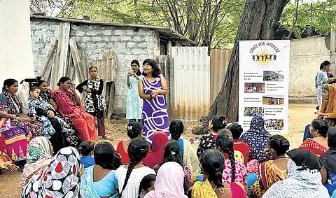 Voice for Welfare volunteers conduct an awareness session on menstrual health near Osmania University in Hyderabad