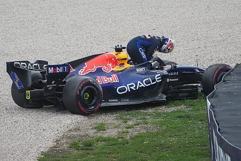 Red Bull driver Max Verstappen of the Netherlands gets out of his car after a crash during the qualifying session .