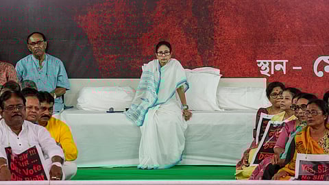 West Bengal Chief Minister Mamata Banerjee stages a sit-in to protest against the alleged arbitrary deletions from the post-SIR electoral rolls in the state, in Kolkata, Friday, March 6, 2026.