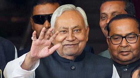 In this photo from Feb 27, 2026, Bihar Chief Minister Nitish Kumar waves as he arrives at the state Assembly during the budget session in Patna.