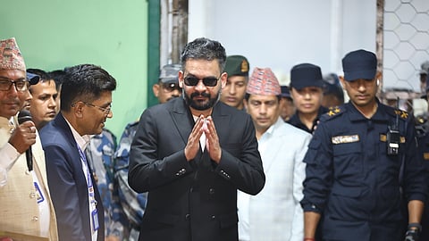Balendra Shah, foreground, former mayor of Kathmandu Metropolitan City and prime ministerial candidate of the Rastriya Swatantra Party, arrives to receive his victory certificate after defeating former Prime Minister KP Sharma Oli of the CPN-UML in Jhapa, March 8, 2026.