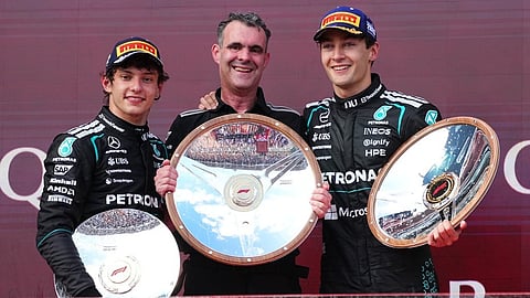 Mercedes' George Russell of Britain, right, celebrates with second placed teammate Andrea Kimi Antonelli, left, of Italy and Hywel Thomas, Managing director of Mercedes AMG High Performance Powertrains after winning the Australian F1 Grand Prix on March 8, 2026.