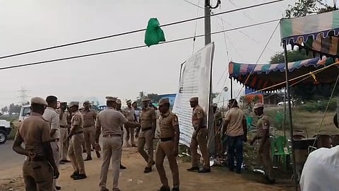 Women opposed police removing the banner, saying they were holding a peaceful roadside sit-in protest.