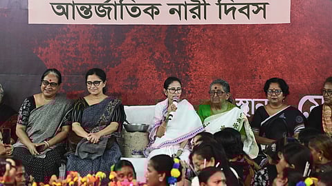 West Bengal Chief Minister Mamata Banerjee, centre, during a sit-in for the third consecutive day, in Kolkata, Sunday, March 8, 2026.