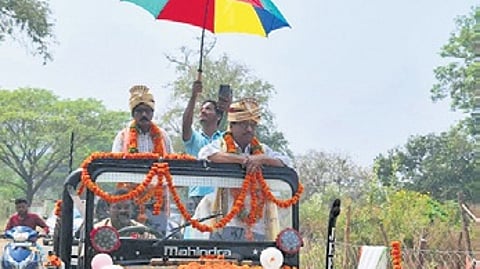 Headmaster Swain being taken in a procession from the school on Monday.