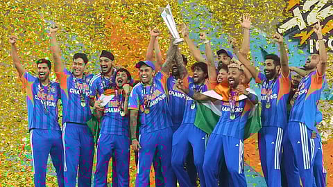 India's players celebrate with the trophy after winning the T20 World Cup final match against New Zealand, in Ahmedabad, India, Sunday, March 8, 2026.