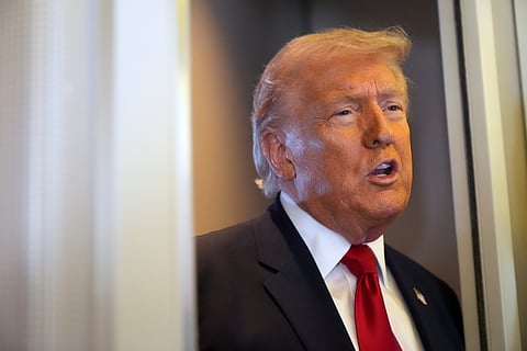 President Donald Trump speaks to reporters while traveling aboard Air Force One en route from Dover Air Force Base, Del., to Miami, Saturday, March 7, 2026.