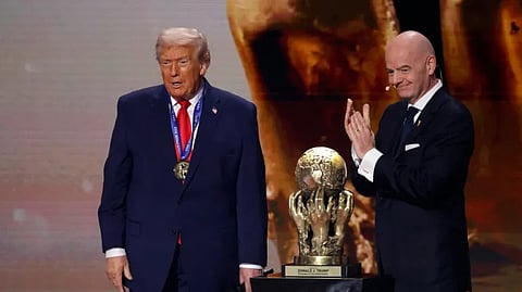 FIFA President Gianni Infantino, right, presents US President Donald Trump with the inaugural FIFA peace prize during the FIFA World Cup 2026 final draw in Washington, DC, in December