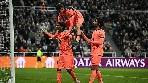 Barcelona's Lamine Yamal (L) celebrates scoring the team's first goal during the UEFA Champion's League, round of 16 football match between Newcastle United and FC Barcelona on March 10, 2026.