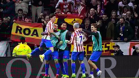 Atletico Madrid's Julian Alvarez, left, celebrates with teammates after scoring his side's fifth goal during the first leg of the Champions League round of 16 soccer match between Atletico Madrid and Tottenham on March 10, 2026.