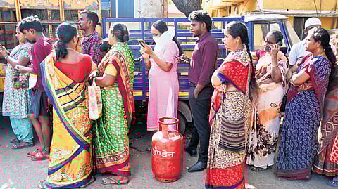 People queued up for LPG cylinders outside a gas agency at Besant Nagar in Chennai on Wednesday.