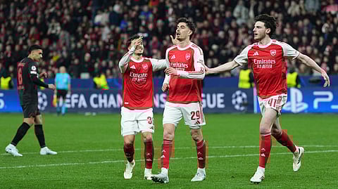 Arsenal's Kai Havertz, center, reacts after scoring a penalty during the Champions League round of 16 first leg soccer match between Bayer Leverkusen and Arsenal FC in Leverkusen, Germany, Wednesday, March 11, 2026.