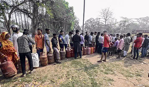 People stand in a queue for LPG cylinders amid an ongoing LPG supply shortage, in Patna on Friday. (Representative Image)