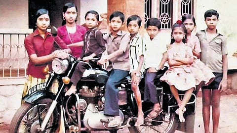 Sai Kiran (fourth from left), his siblings, cousins and mother with the Royal Enfield used by his father in 1985.