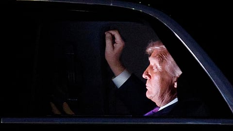 US President Donald Trump is seen in his limousine, known as "The Beast", for the motorcade to the White House after his arrival on Air Force One at Joint Base Andrews, Md., Wednesday, March 11, 2026.
