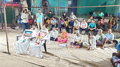 Villagers staging a protest against the trucks transporting coal in Angul.