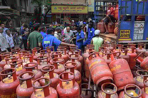 Consumers gather to avail LPG cylinders amid supply crisis in the country, in Mumbai, Maharashtra, Friday, March 13, 2026.