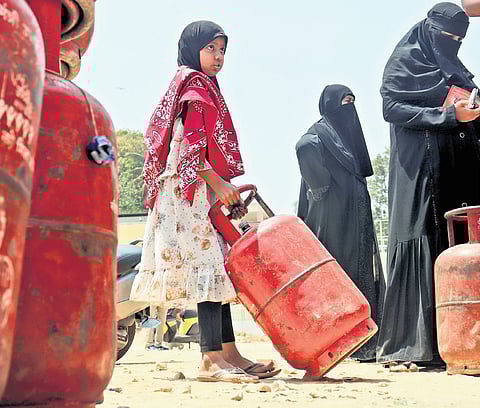 Panic buying continues as people queue up at an LPG outlet in Tilak Nagar, Bengaluru, on Saturday.