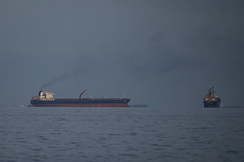 Oil tankers and cargo ships line up in the Strait of Hormuz as seen from Khor Fakkan, United Arab Emirates, Wednesday, March 11, 2026.