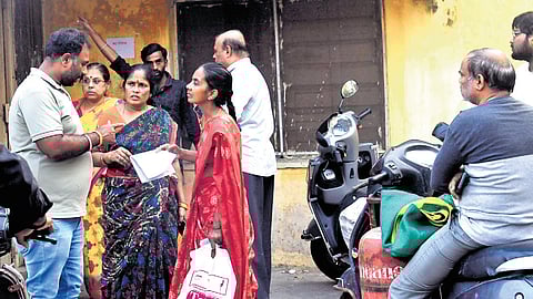 Citizens wait for the cylinder refills at the Telangana Civil Supplies LPG godown at Azamabad in Hyderabad on Saturday