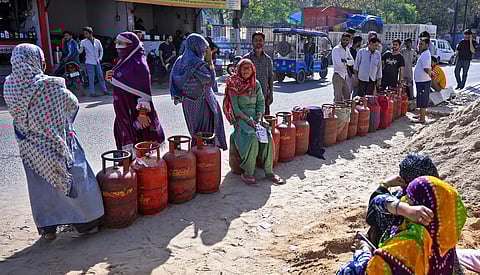 People wait in a queue with LPG cylinders amid a supply crisis, in Jaipur, Sunday, March 15, 2026.
