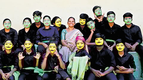 Students of Kalveerampalayam Government Higher Secondary School, who perform street plays on social issues, along with teacher Sasikala.