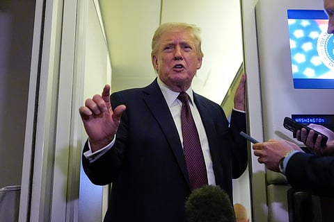 President Donald Trump speaks to reporters aboard Air Force One, Sunday, March 15, 2026, en route from West Palm Beach, Fla. to Joint Base Andrews, Md.