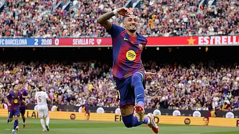 Barcelona's Raphinha celebrates after scoring during the Spanish La Liga soccer match between Barcelona and Sevilla in Barcelona, Spain, Sunday, March 15, 2026.