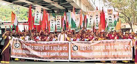 Anganwadi workers and helpers taking out the protest rally on Monday.