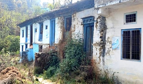 Rusting padlocks hang on doors that have not been opened in years, while wild creepers and thickets have begun reclaiming courtyards and pathways.