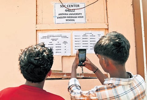 Students checking their hall-ticket numbers at the AU High School, an SSC examination centre, in Visakhapatnam on Sunday.