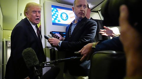 President Donald Trump speaks to reporters aboard Air Force One, Sunday, March 15, 2026, en route from West Palm Beach, Fla. to Joint Base Andrews, Md.