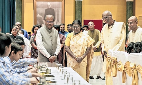 President Murmu and Minister Dharmendra Pradhan in New Delhi on Tuesday