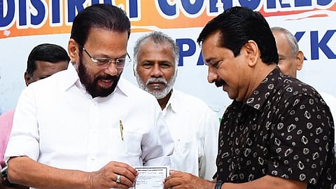 A Suresh receiving Congress membership from Palakkad DCC president A Thankappan on Tuesday