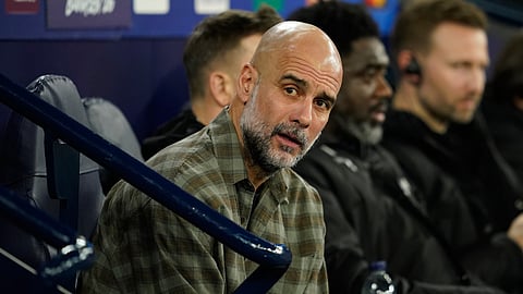 Manchester City's head coach Pep Guardiola watches from the bench ahead of the Champions League round of 16 second leg soccer match between Manchester City and Real Madrid in Manchester, Tuesday, March 17, 2026.