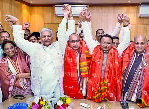 Odisha Chief Minister Mohan Charan Majhi, second right, with BJP Rajya Sabha winners Sujeet Kumar and Manmohan Samal, right, at his assembly office following their victory in the upper house elections, in Bhubaneswar, Monday, March 16, 2026.