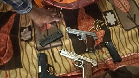 Police recovered three weapons from them.