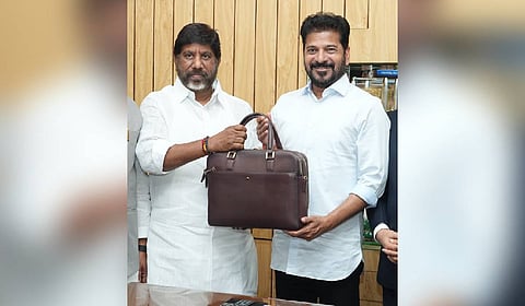 Deputy Chief Minister and Finance Minister Mallu Bhatti Vikramarka (left) presenting Budget estimates to Chief Minister A Revanth Reddy at the lobbies of the Assembly in Hyderabad on Friday.