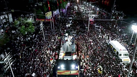 In this photo from Sep 27, 2025, Tamilaga Vettri Kazhagam (TVK) chief and actor Vijay addresses a gathering before a fatal stampede during a public event in Karur.