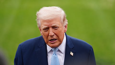 US President Donald Trump speaks with reporters before departing on Marine One from the South Lawn of the White House, Friday, March 20, 2026, in Washington.